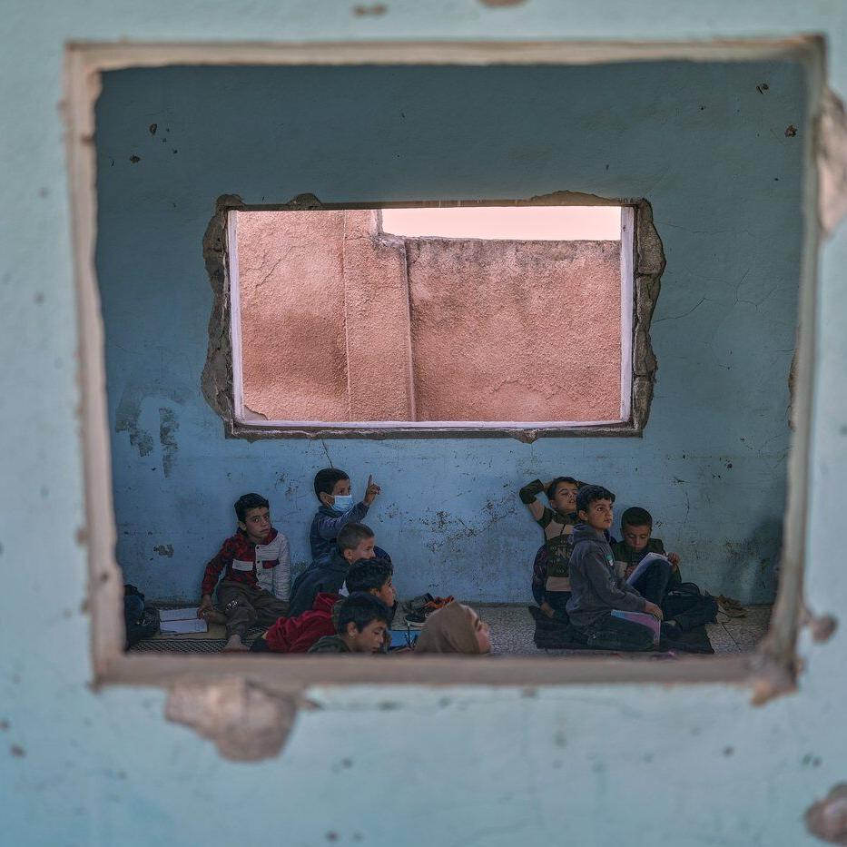 Photos show Syrian students returning to schools stripped bare by conflict
